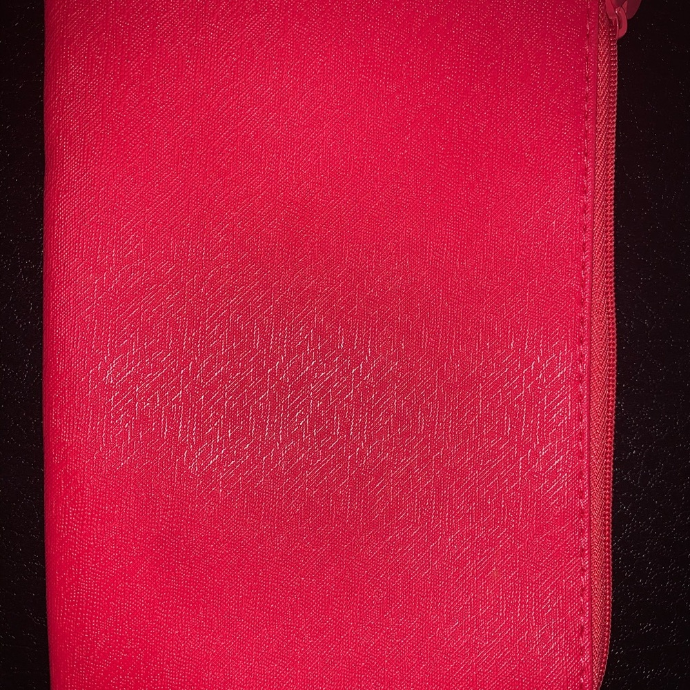 A pink striped clutch